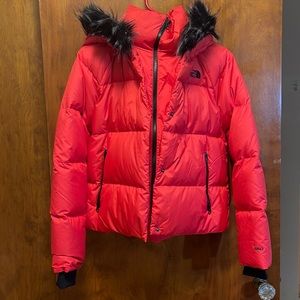 Red NorthFace winter jacket.